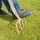 Man spike aerating the grass with a pitchfork